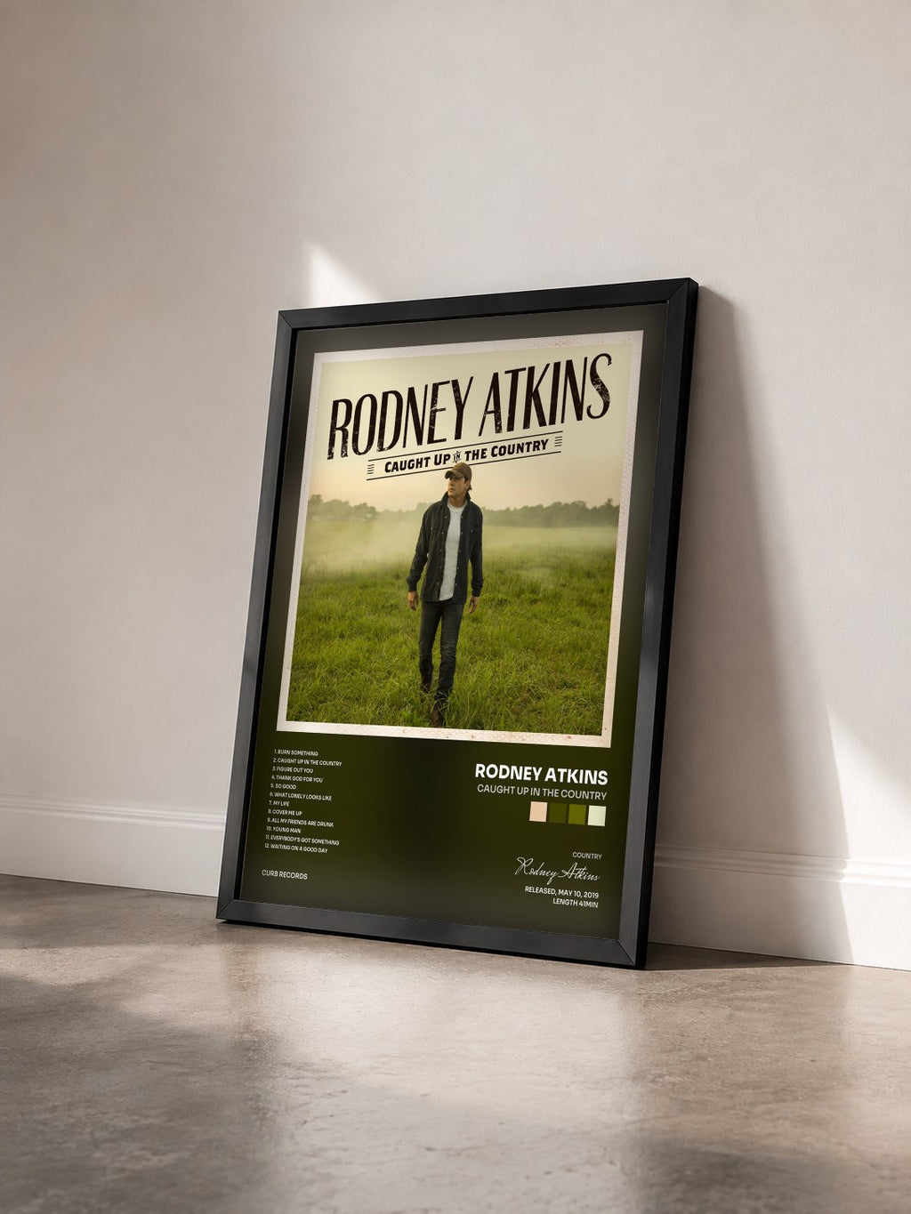 #noir Tableau de l'album Caught Up In The Country de Rodney Atkins vu de trois quarts, cadre noir