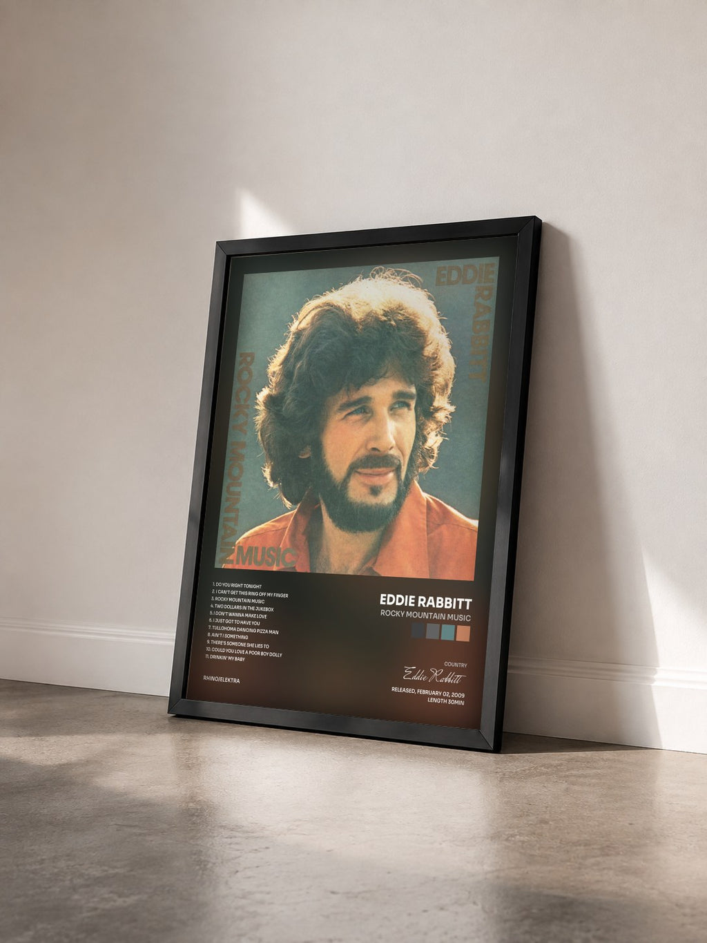 #noir Tableau de l'album Rocky Mountain Music de Eddie Rabbitt vu de trois quarts, cadre noir