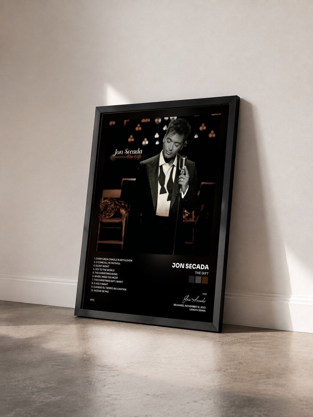 #noir Tableau de l'album The Gift de Jon Secada vu de trois quarts, cadre noir