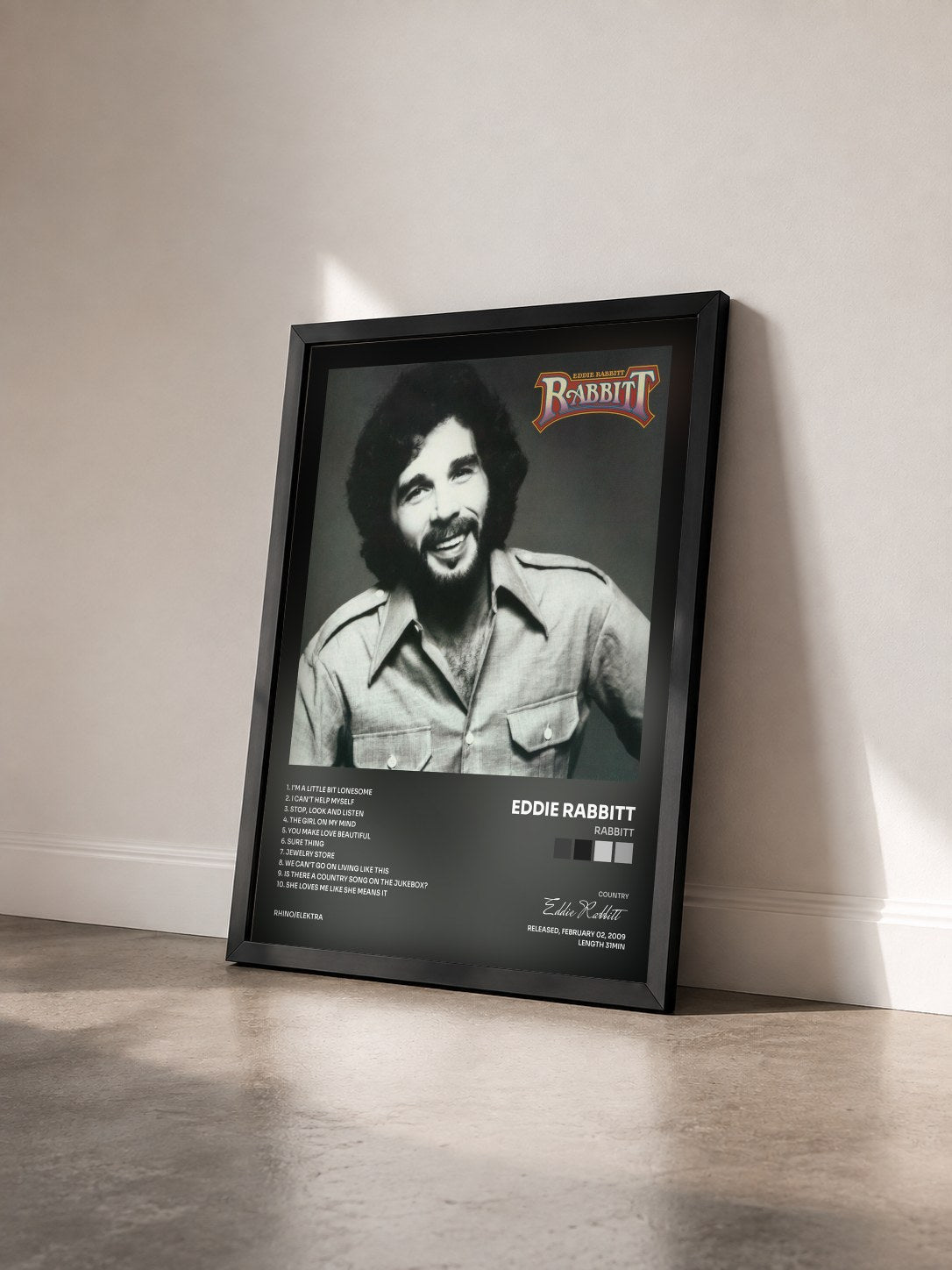 #noir Tableau de l'album Rabbitt de Eddie Rabbitt vu de trois quarts, cadre noir
