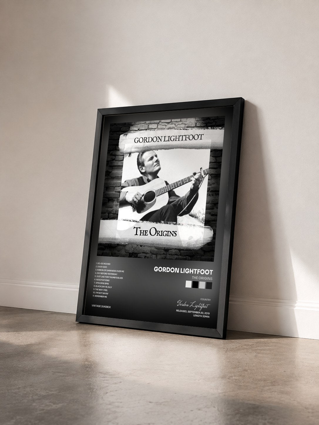 #noir Tableau de l'album The Origins de Gordon Lightfoot vu de trois quarts, cadre noir