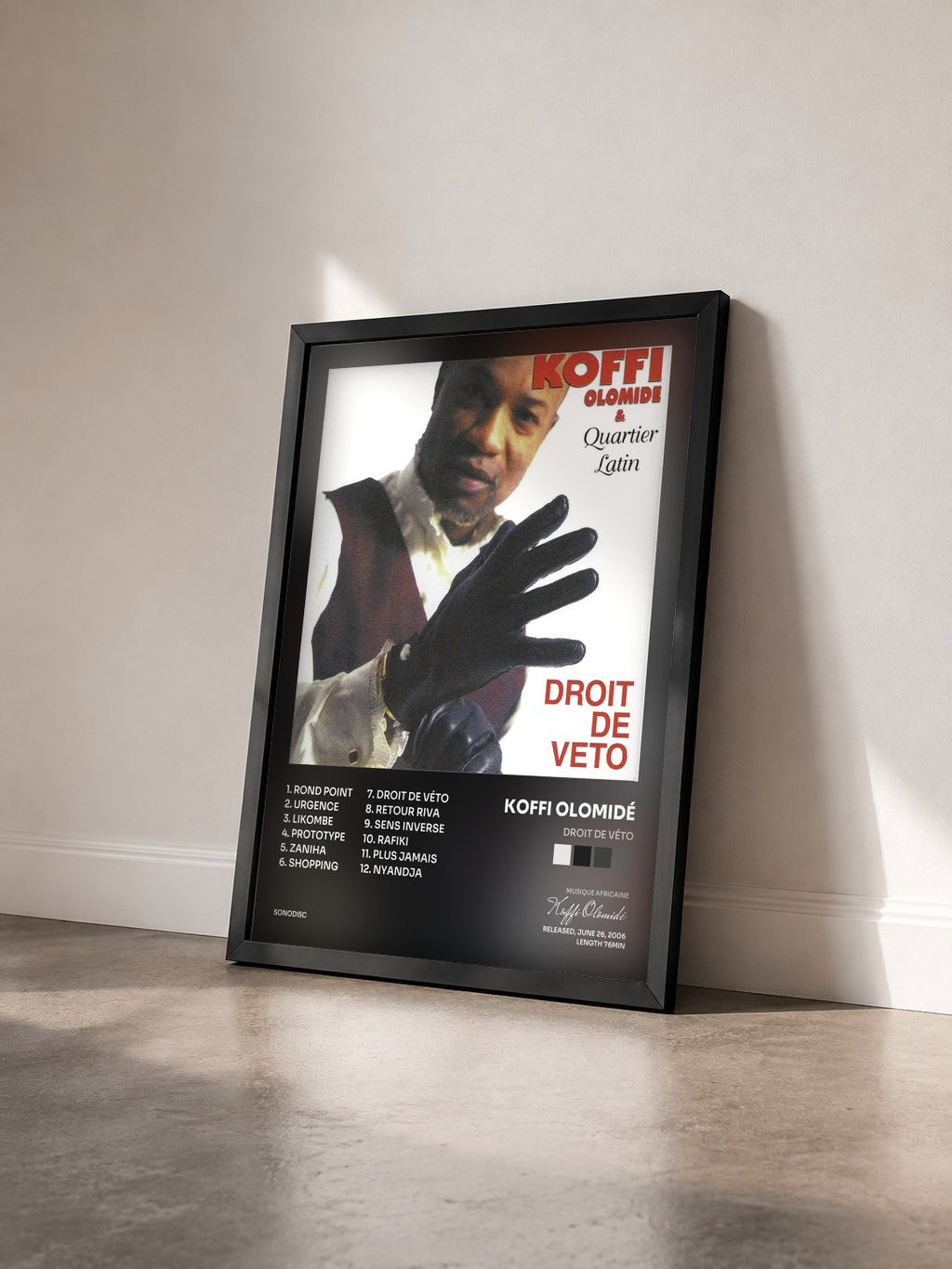#noir Tableau de l'album Droit de véto de Koffi Olomidé vu de trois quarts, cadre noir
