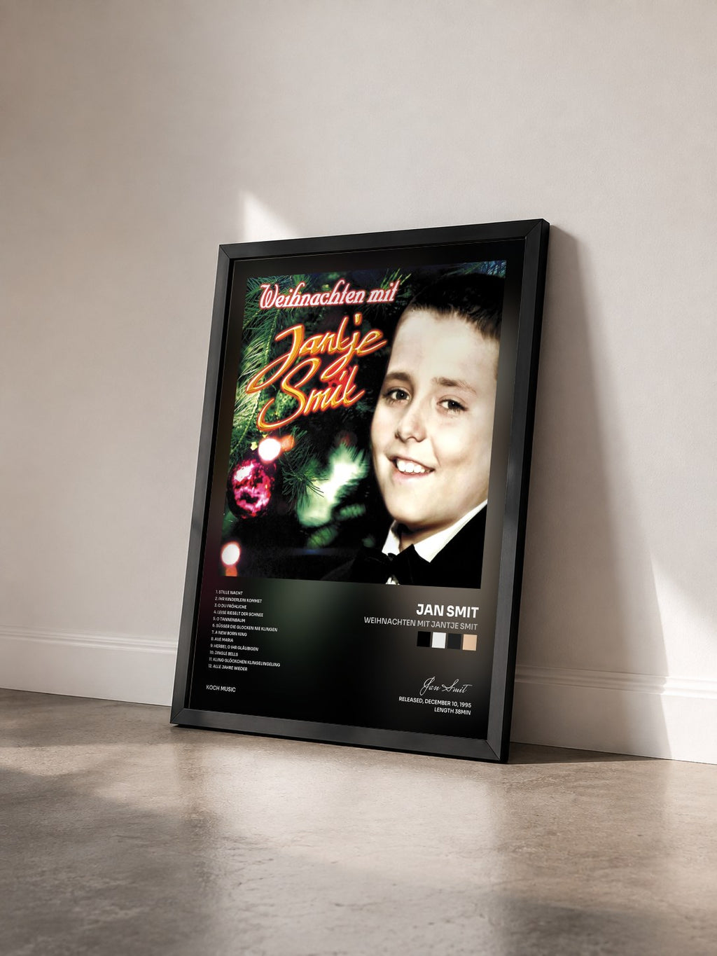 #noir Tableau de l'album Weihnachten mit Jantje Smit de Jan Smit vu de trois quarts, cadre noir