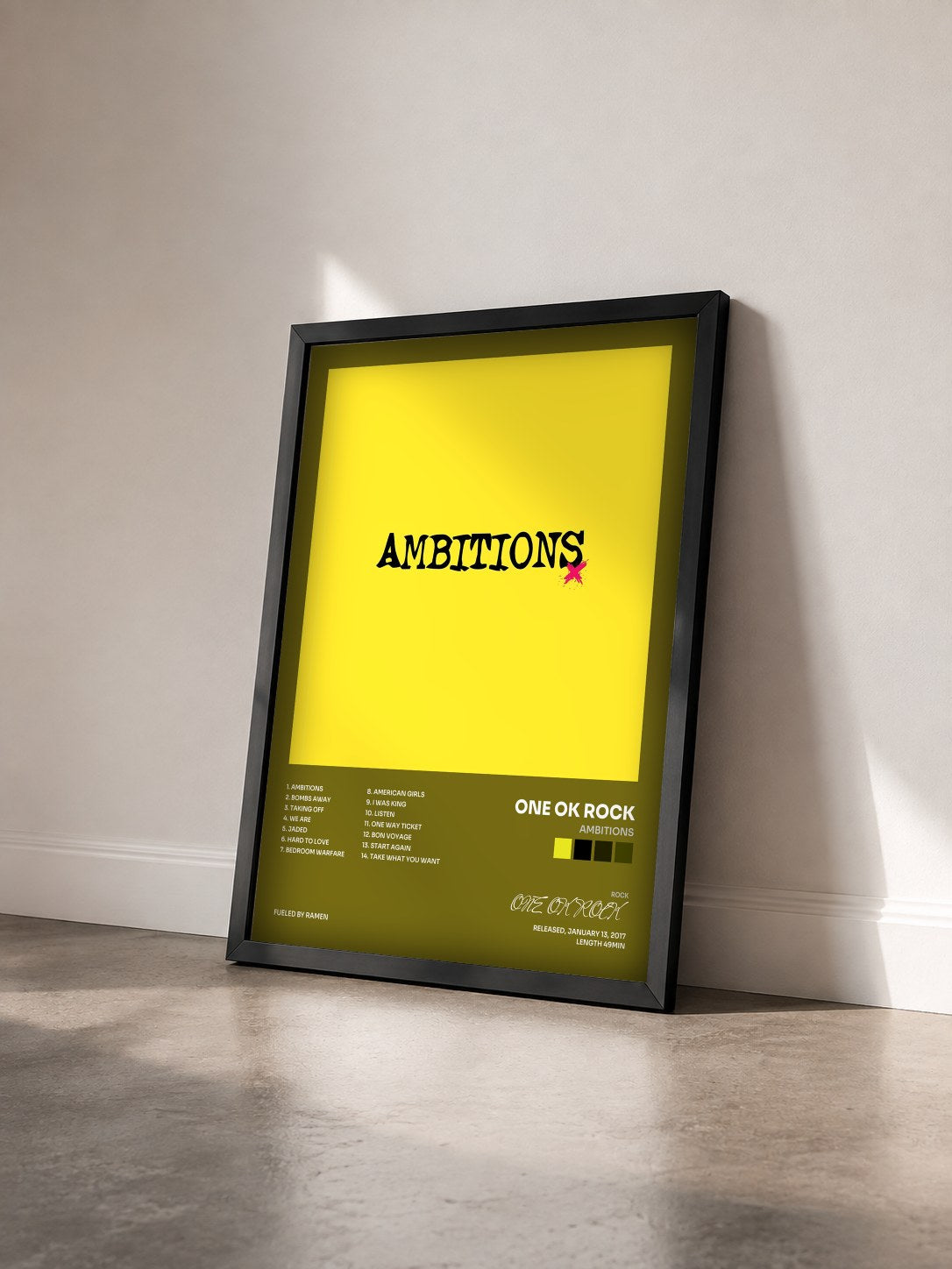 #noir Tableau de l'album Ambitions de ONE OK ROCK vu de trois quarts, cadre noir