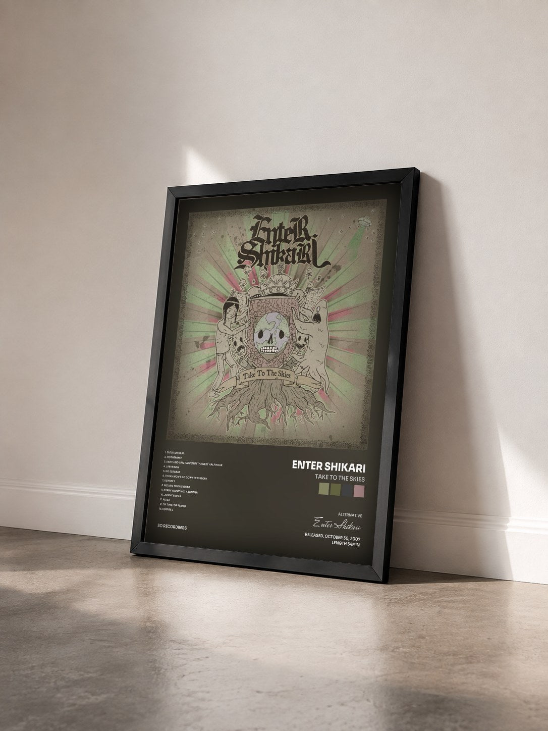 #noir Tableau de l'album Take to the Skies de Enter Shikari vu de trois quarts, cadre noir