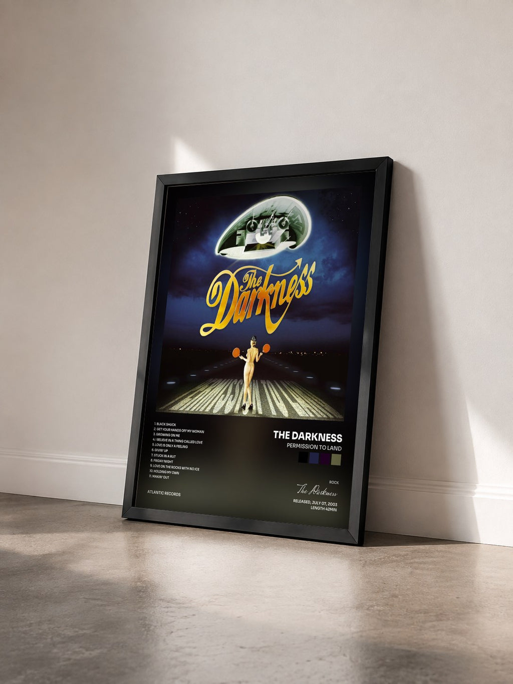 #noir Tableau de l'album Permission to Land de The Darkness vu de trois quarts, cadre noir