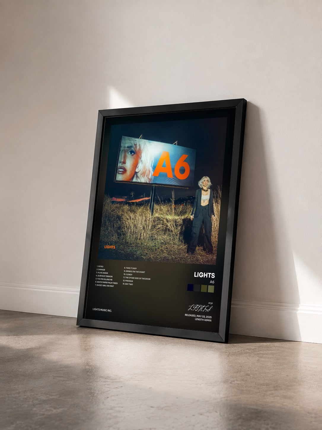 #noir Tableau de l'album A6 de LIGHTS vu de trois quarts, cadre noir