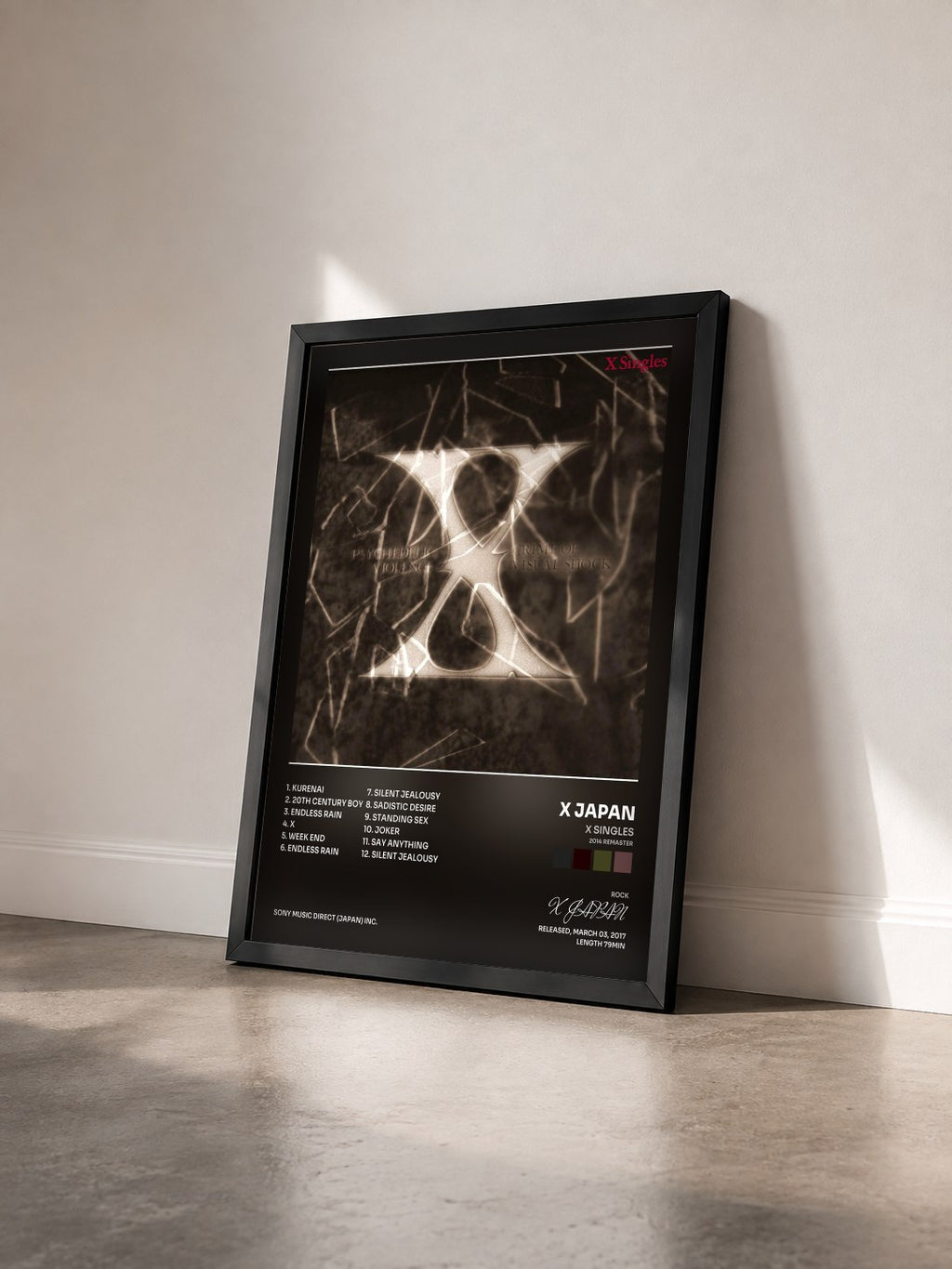 #noir Tableau de l'album X Singles (2014 Remaster) de X JAPAN vu de trois quarts, cadre noir