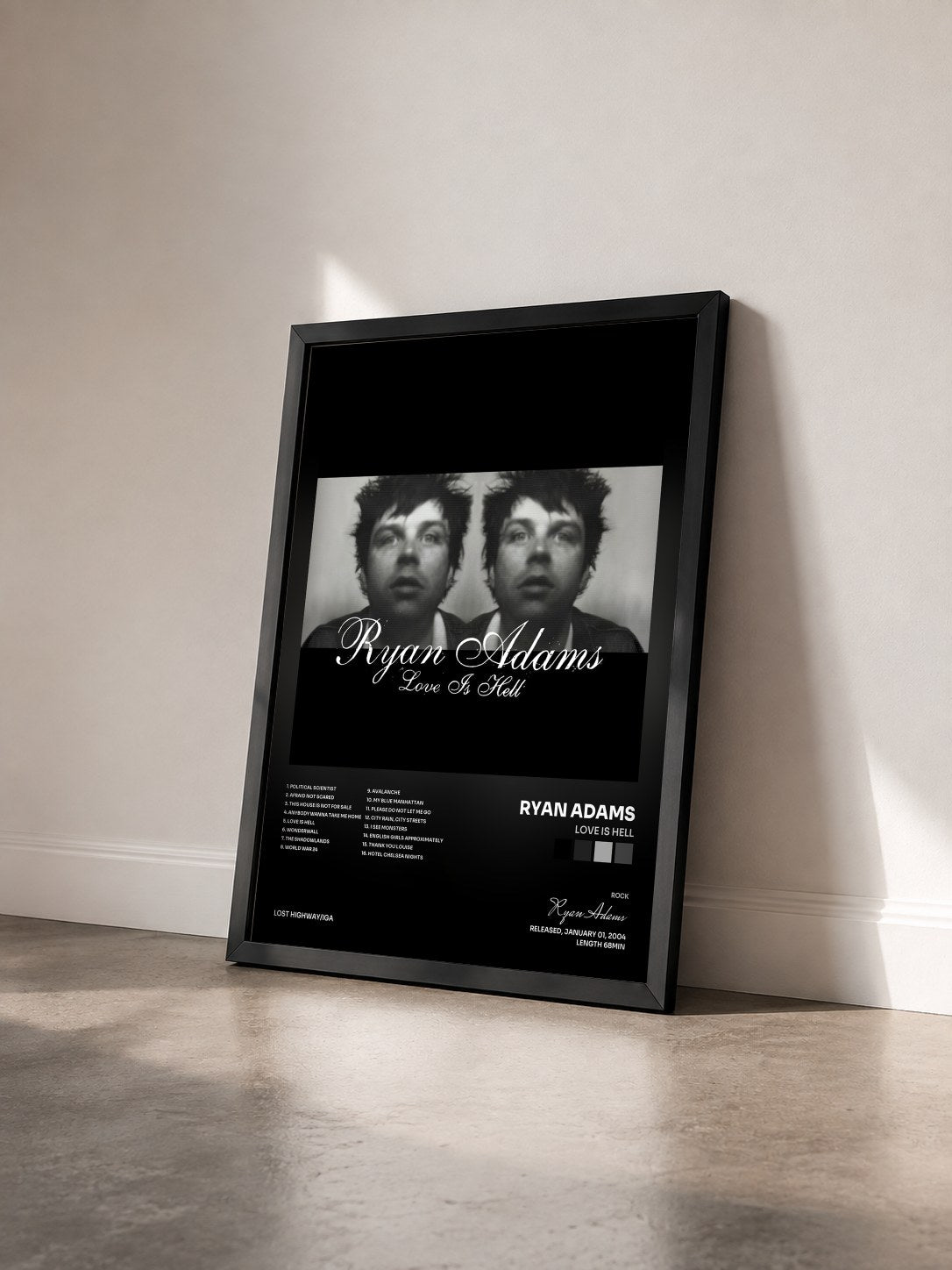 #noir Tableau de l'album Love Is Hell de Ryan Adams vu de trois quarts, cadre noir