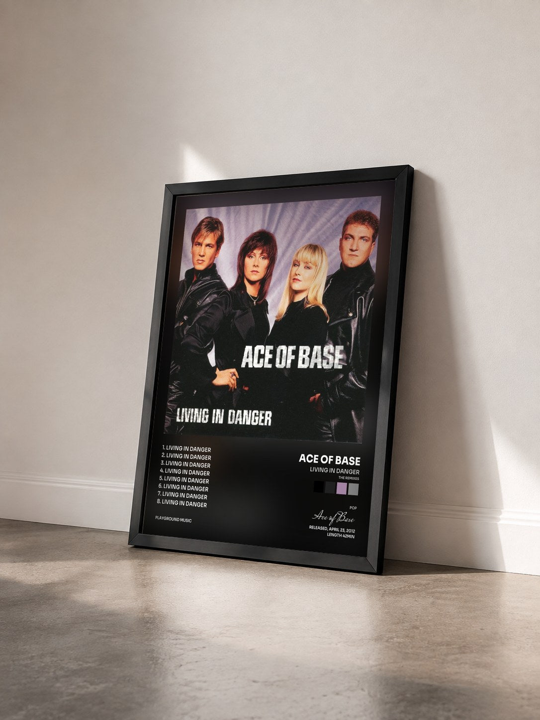 #noir Tableau de l'album Living in Danger (The Remixes) de Ace of Base vu de trois quarts, cadre noir