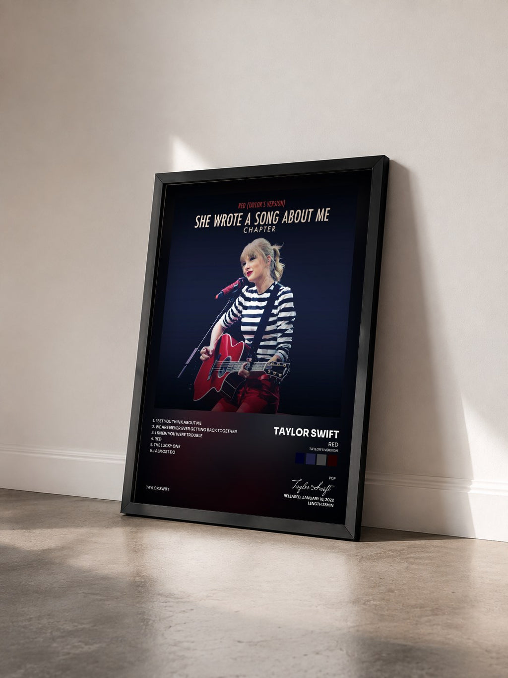 #noir Tableau de l'album Red (Taylor’s Version): She Wrote A Song About Me Chapter de Taylor Swift vu de trois quarts, cadre noir
