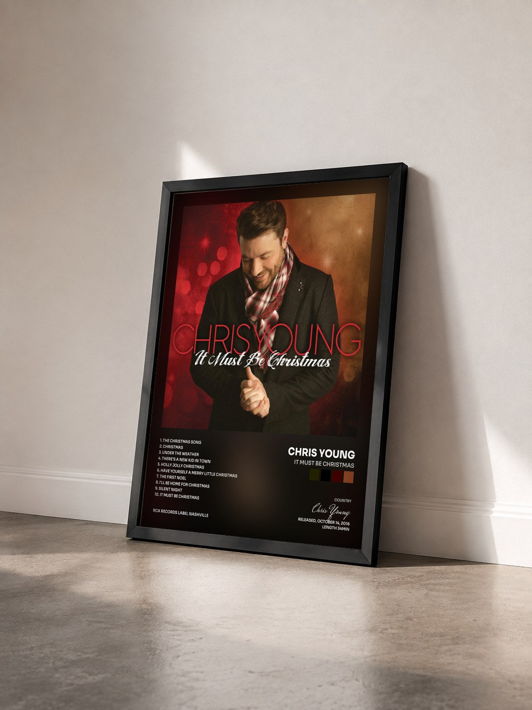#noir Tableau de l'album It Must Be Christmas de Chris Young vu de trois quarts, cadre noir
