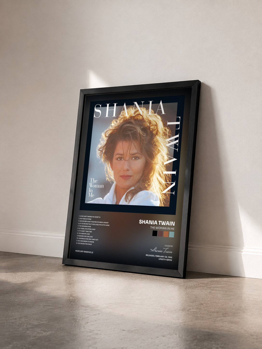 #noir Tableau de l'album The Woman In Me de Shania Twain vu de trois quarts, cadre noir