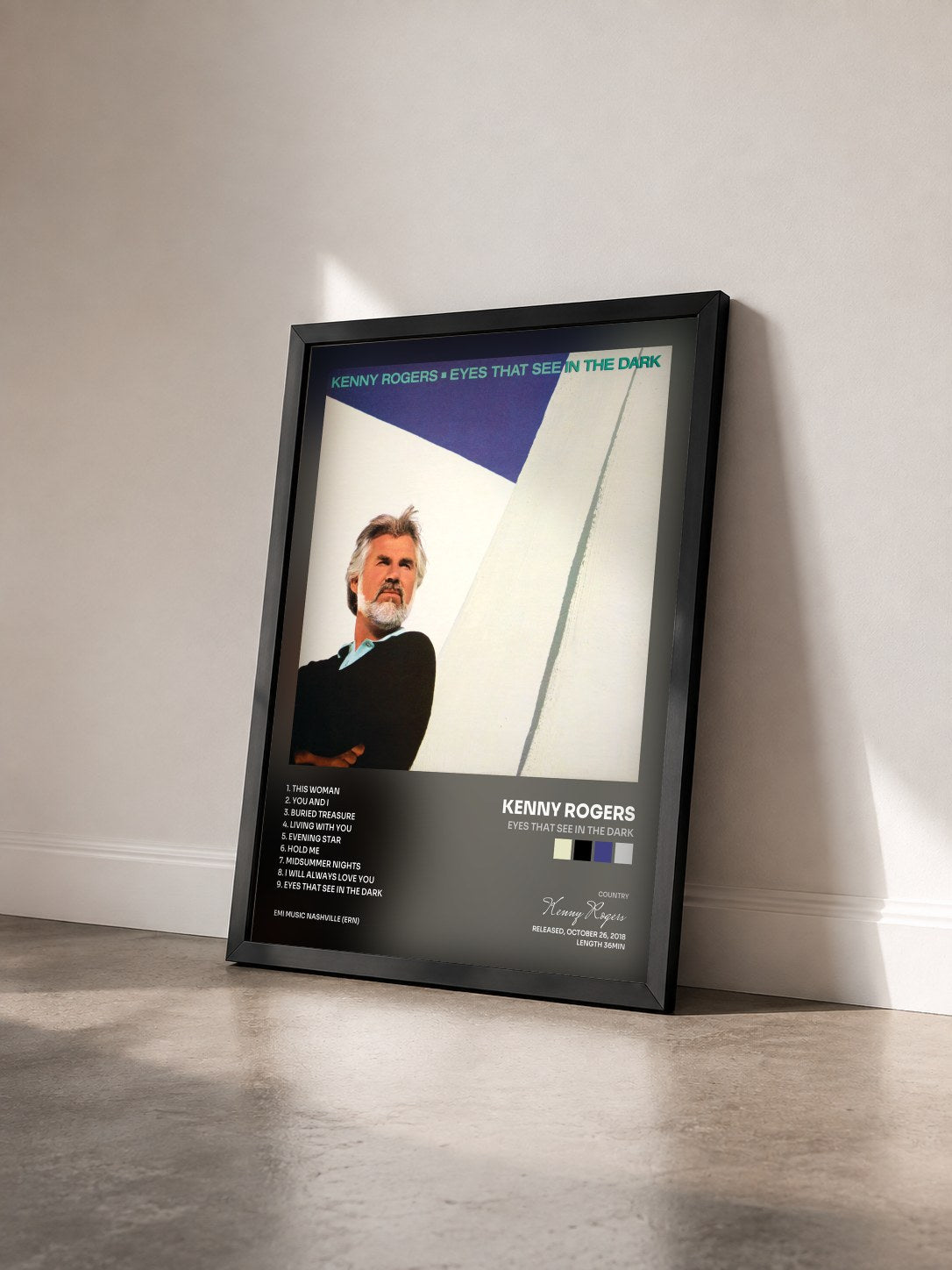 #noir Tableau de l'album Eyes That See In The Dark de Kenny Rogers vu de trois quarts, cadre noir