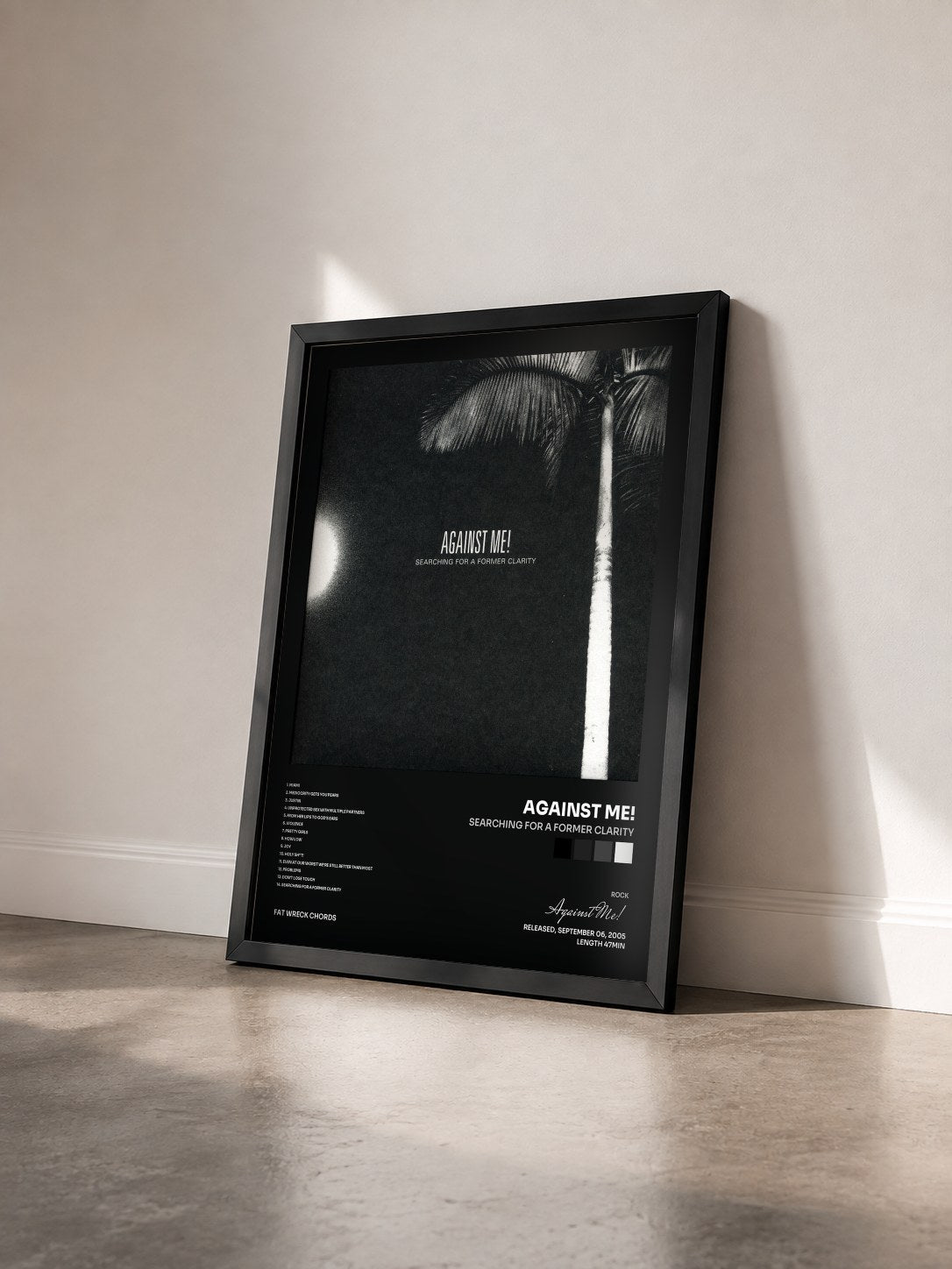 #noir Tableau de l'album Searching for a Former Clarity de Against Me! vu de trois quarts, cadre noir