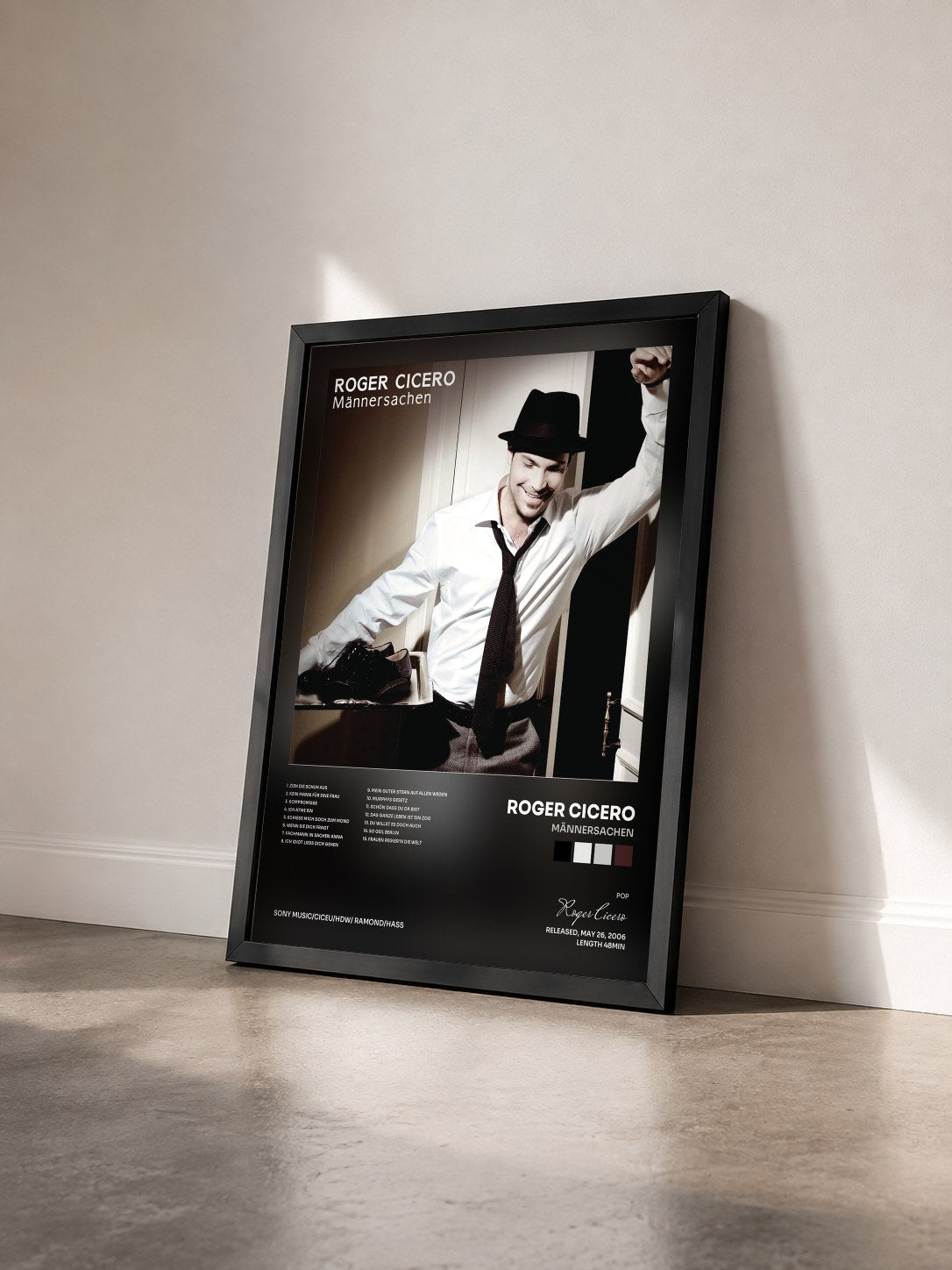 #noir Tableau de l'album Männersachen de Roger Cicero vu de trois quarts, cadre noir