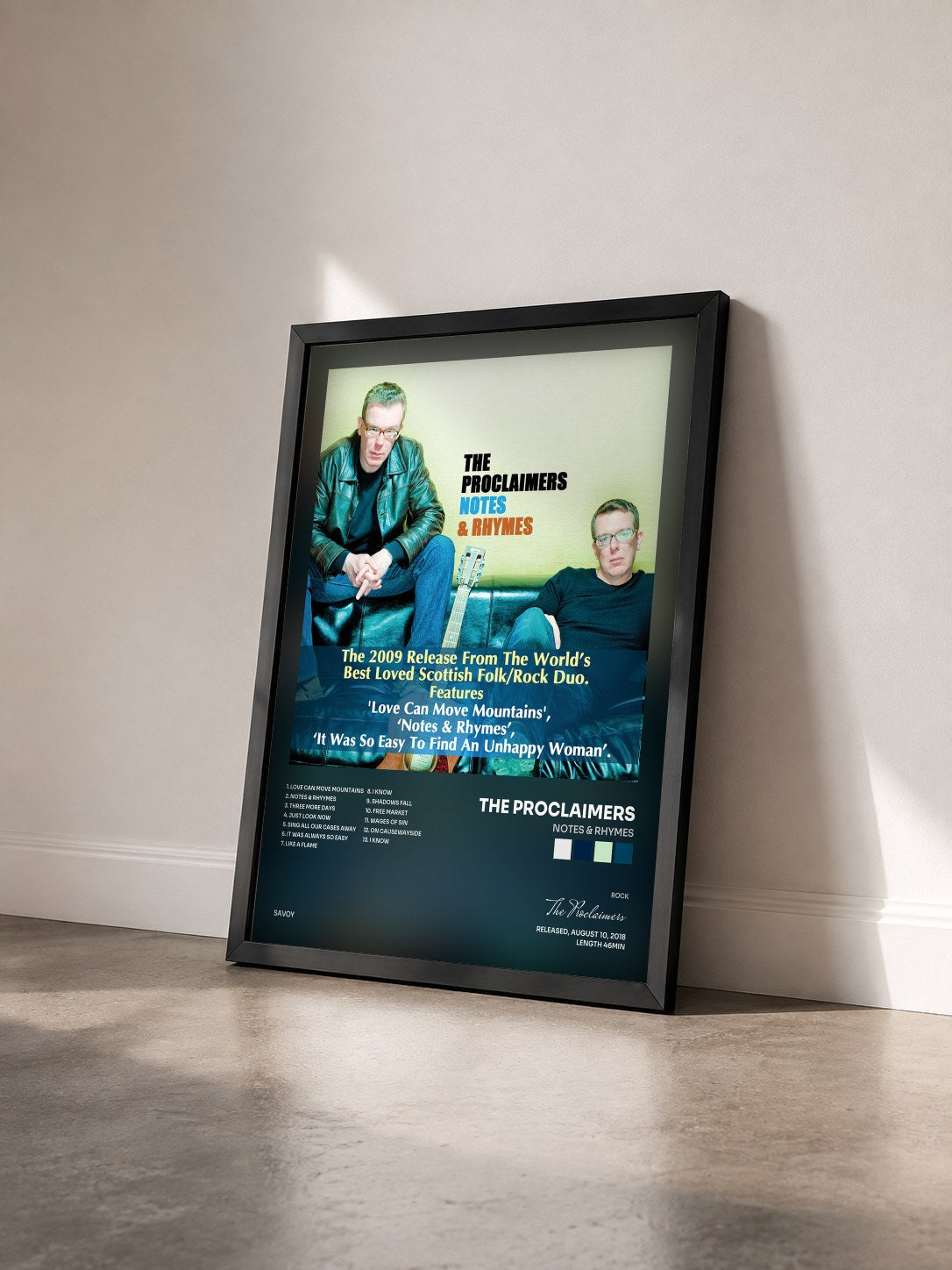 #noir Tableau de l'album Notes & Rhymes de The Proclaimers vu de trois quarts, cadre noir