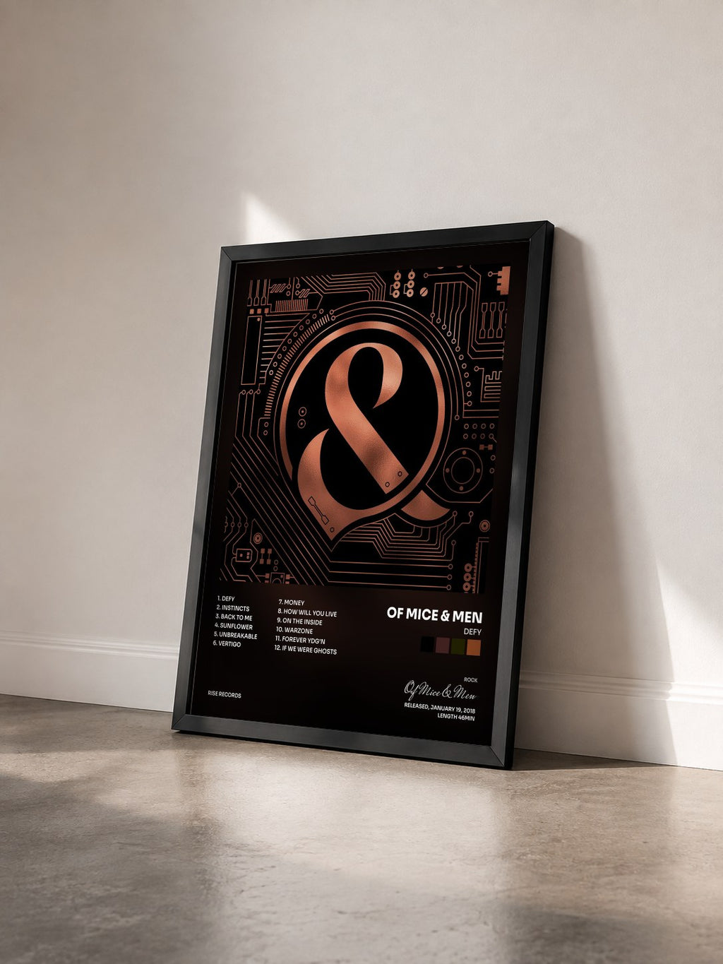 #noir Tableau de l'album Defy de Of Mice & Men vu de trois quarts, cadre noir