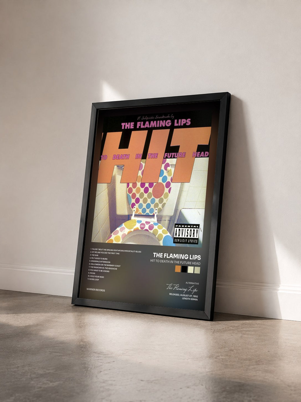 #noir Tableau de l'album Hit to Death in the Future Head de The Flaming Lips vu de trois quarts, cadre noir