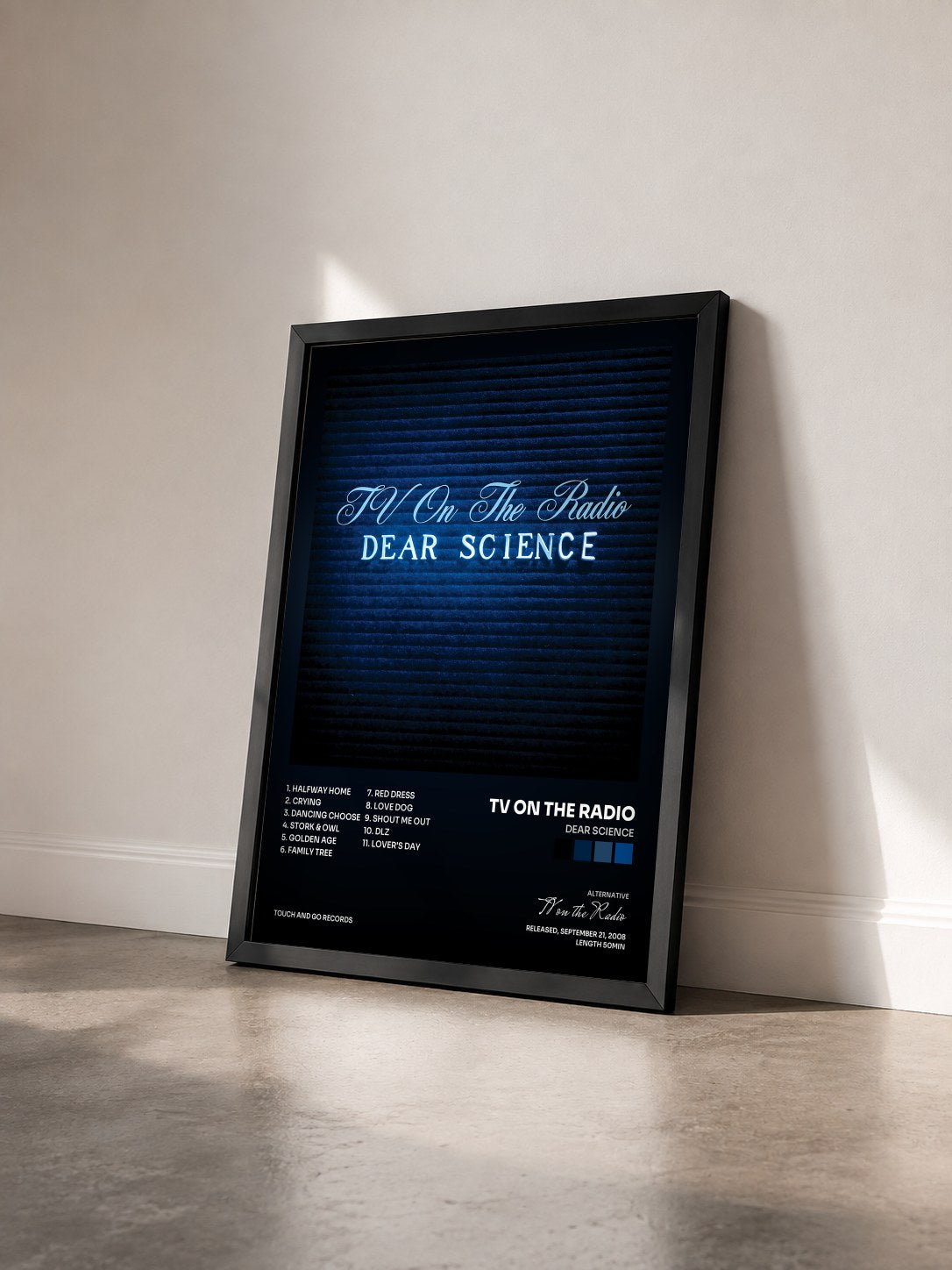 #noir Tableau de l'album Dear Science de TV on the Radio vu de trois quarts, cadre noir