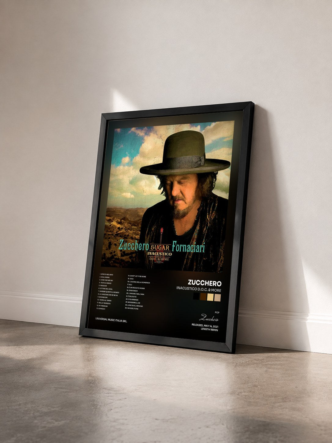 #noir Tableau de l'album INACUSTICO D.O.C. & MORE de Zucchero vu de trois quarts, cadre noir