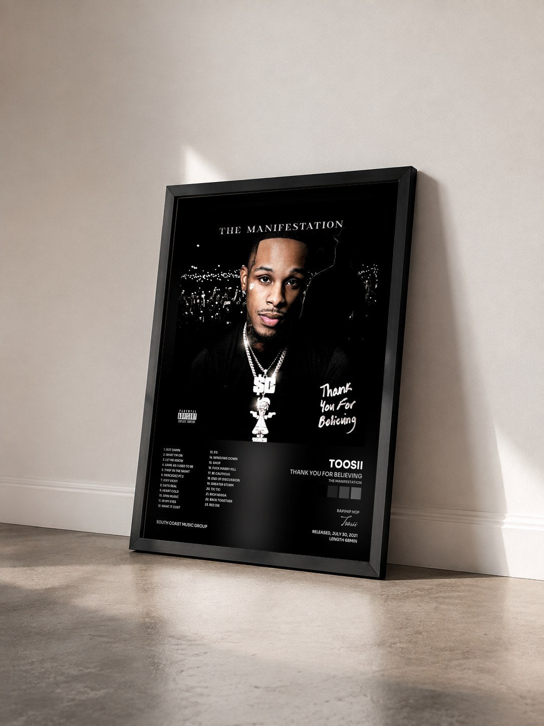 #noir Tableau de l'album Thank You For Believing (The Manifestation) de Toosii vu de trois quarts, cadre noir