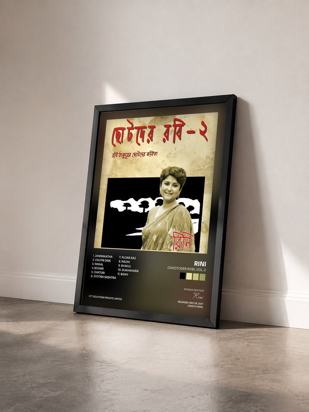 #noir Tableau de l'album Chhotoder Robi, Vol. 2 de Rini vu de trois quarts, cadre noir