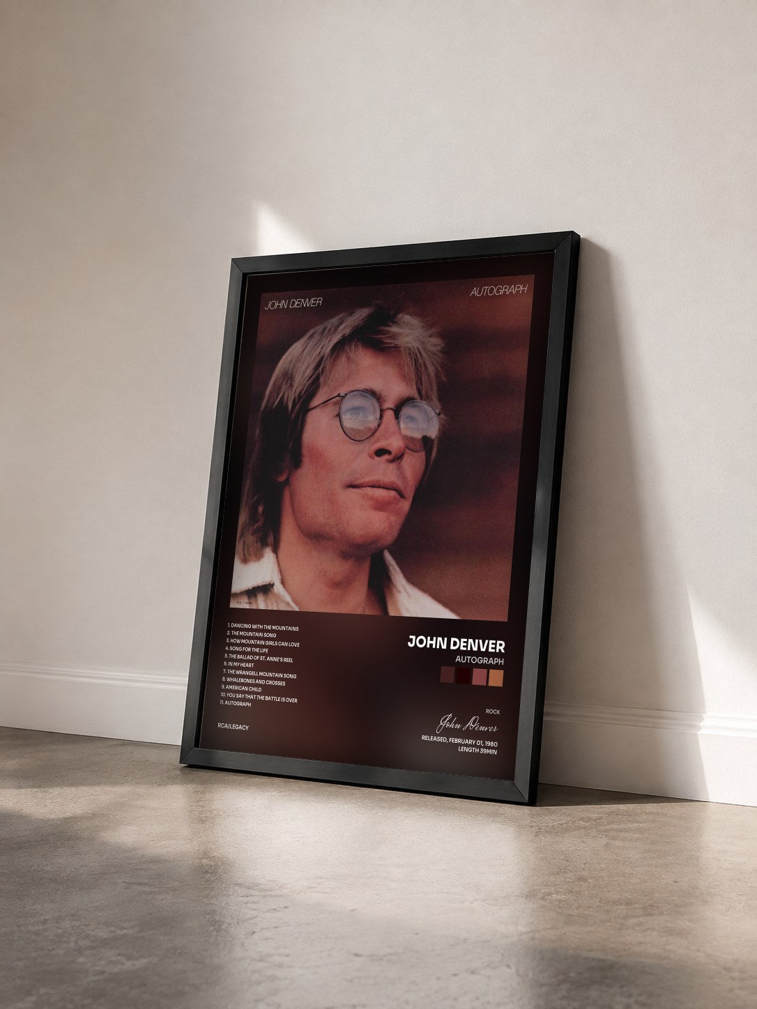 #noir Tableau de l'album Autograph de John Denver vu de trois quarts, cadre noir