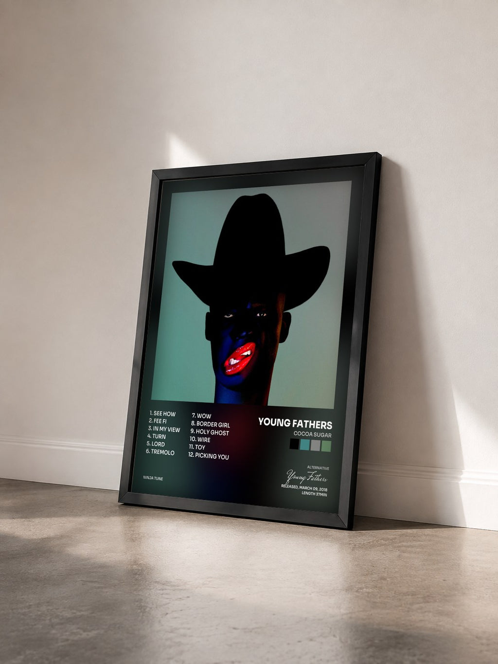 #noir Tableau de l'album Cocoa Sugar de Young Fathers vu de trois quarts, cadre noir