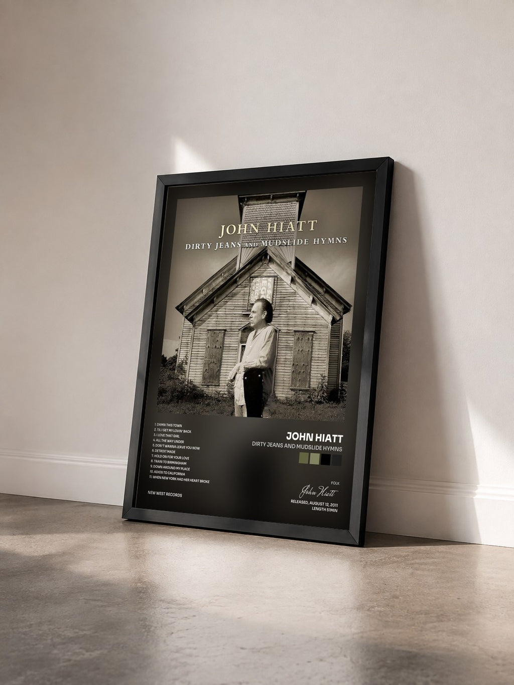 #noir Tableau de l'album Dirty Jeans and Mudslide Hymns de John Hiatt vu de trois quarts, cadre noir
