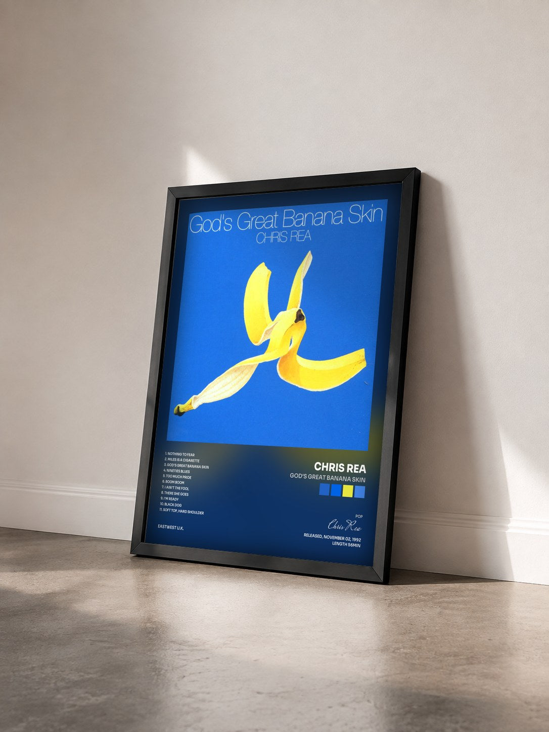 #noir Tableau de l'album God's Great Banana Skin de Chris Rea vu de trois quarts, cadre noir