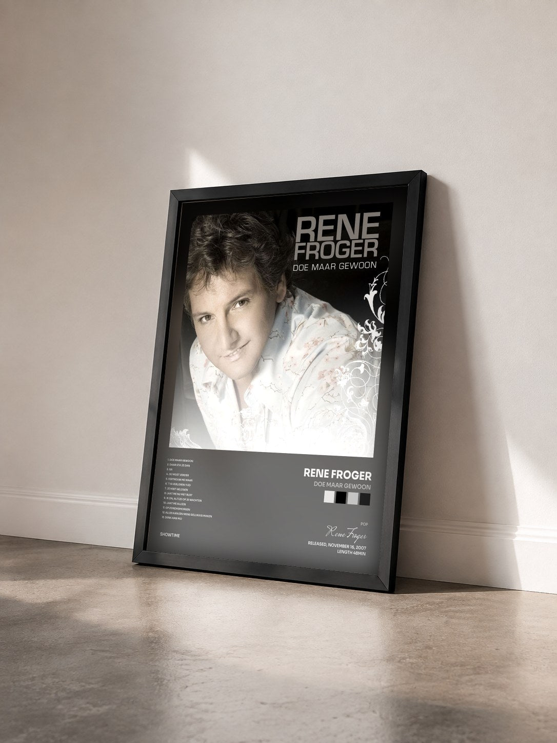 #noir Tableau de l'album Doe Maar Gewoon de Rene Froger vu de trois quarts, cadre noir