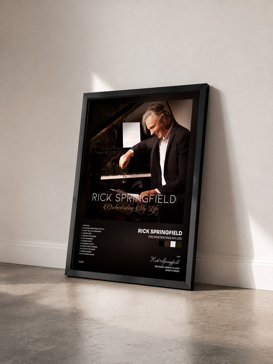 #noir Tableau de l'album Orchestrating My Life de Rick Springfield vu de trois quarts, cadre noir