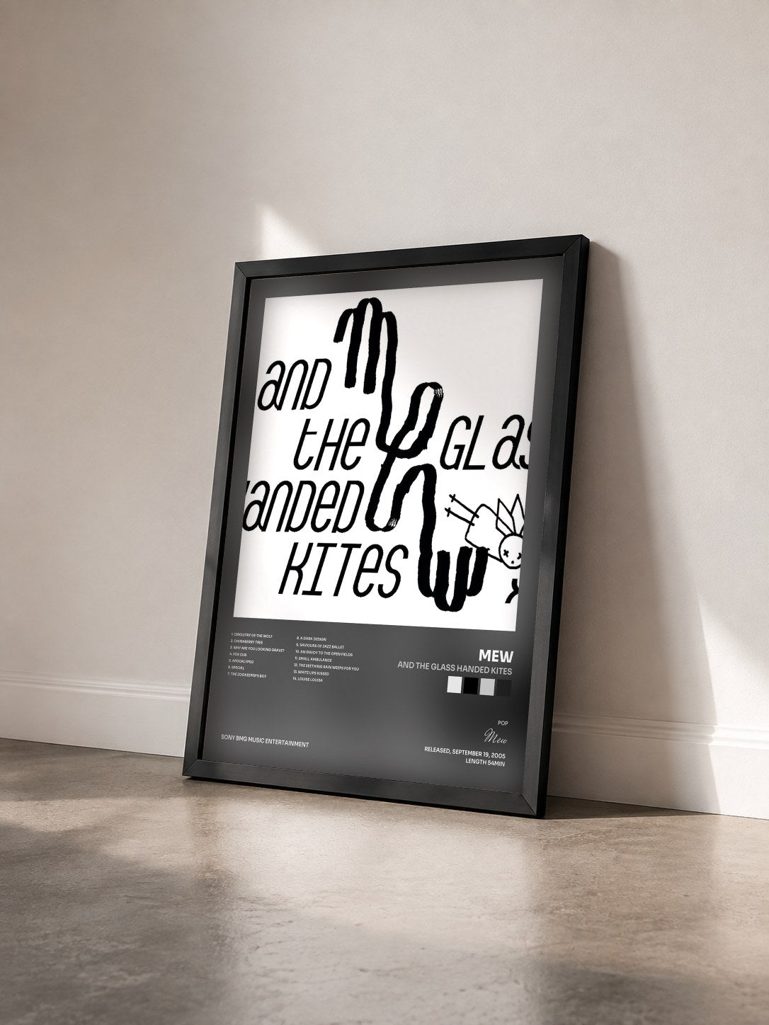 #noir Tableau de l'album And The Glass Handed Kites de Mew vu de trois quarts, cadre noir