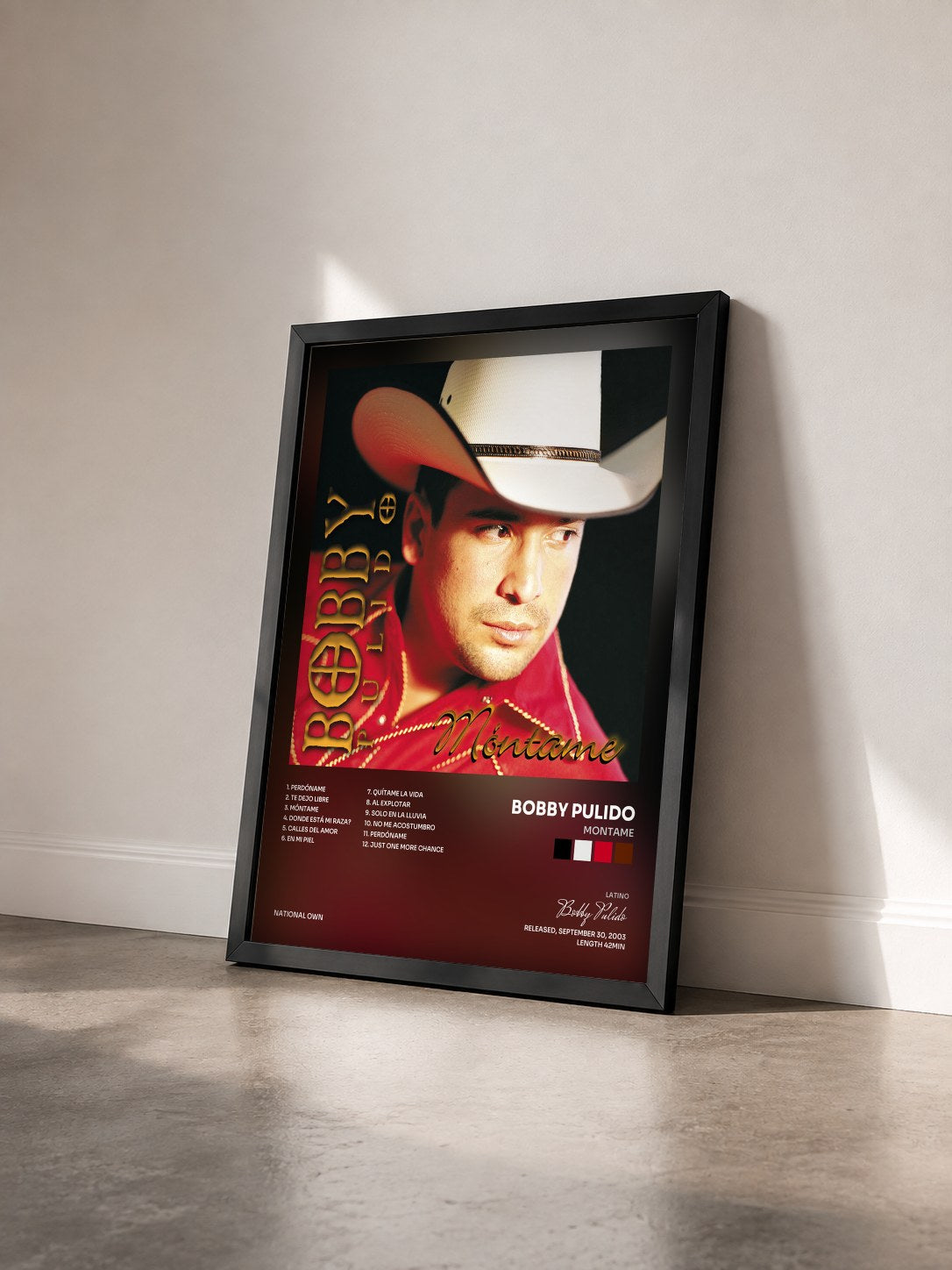 #noir Tableau de l'album Montame de Bobby Pulido vu de trois quarts, cadre noir