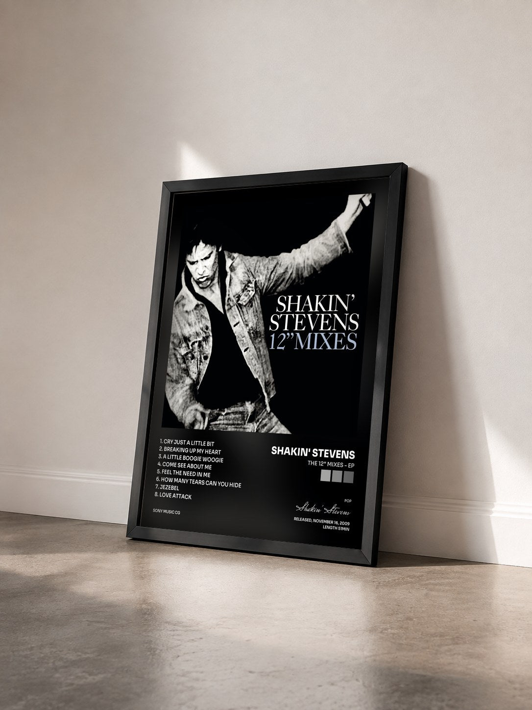 #noir Tableau de l'album The 12" Mixes - EP de Shakin' Stevens vu de trois quarts, cadre noir