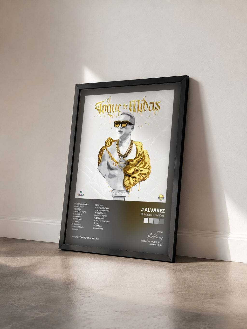#noir Tableau de l'album El Toque de Midas de J Alvarez vu de trois quarts, cadre noir