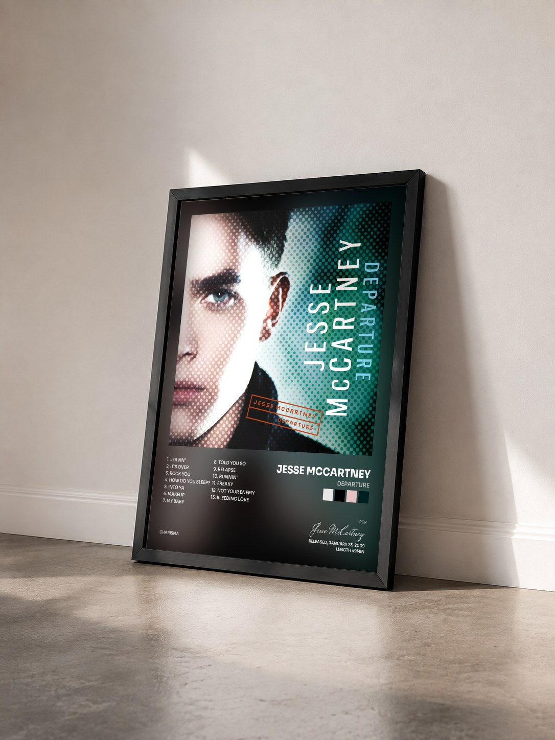#noir Tableau de l'album Departure de Jesse McCartney vu de trois quarts, cadre noir