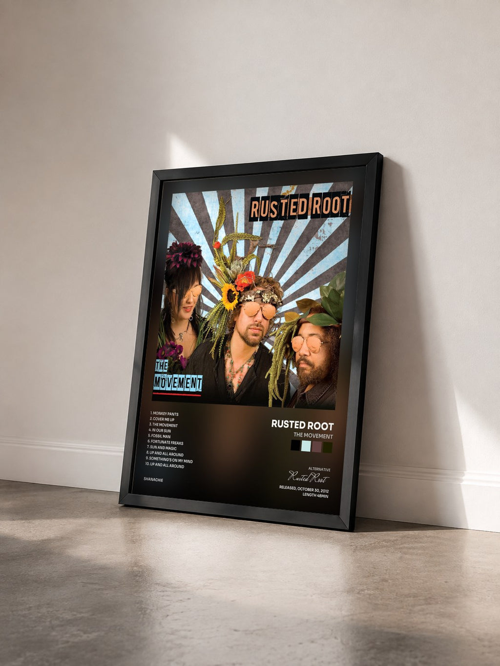 #noir Tableau de l'album The Movement de Rusted Root vu de trois quarts, cadre noir