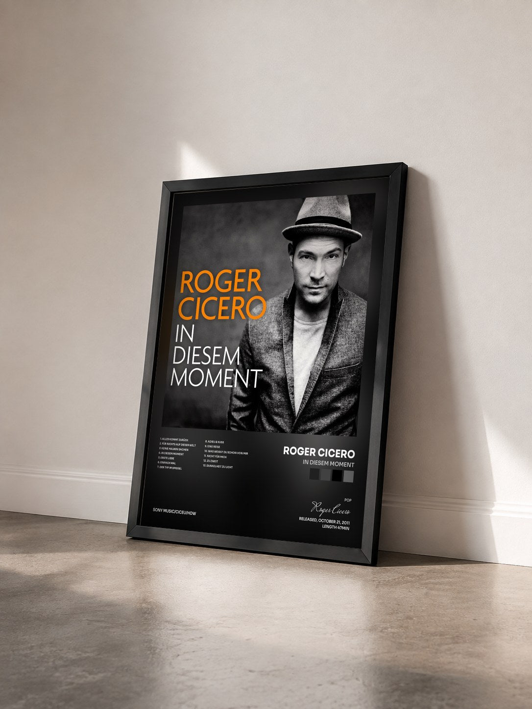 #noir Tableau de l'album In diesem Moment de Roger Cicero vu de trois quarts, cadre noir