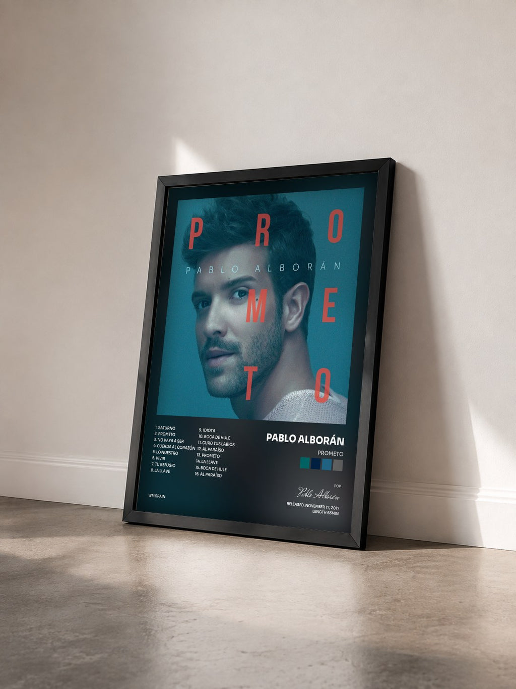 #noir Tableau de l'album Prometo de Pablo Alborán vu de trois quarts, cadre noir