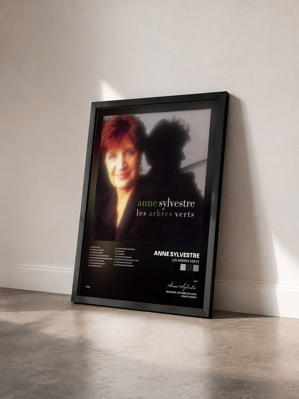 #noir Tableau de l'album Les arbres verts de Anne Sylvestre vu de trois quarts, cadre noir