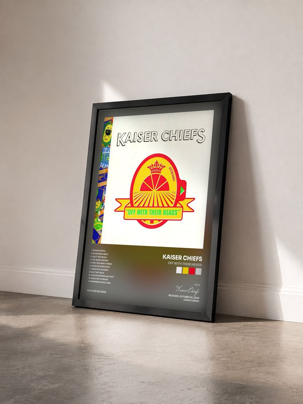 #noir Tableau de l'album Off With Their Heads de Kaiser Chiefs vu de trois quarts, cadre noir