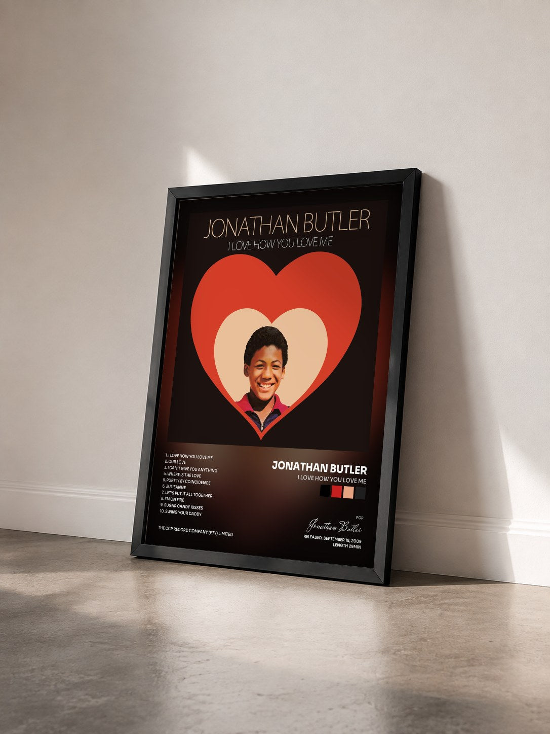 #noir Tableau de l'album I Love How You Love Me de Jonathan Butler vu de trois quarts, cadre noir