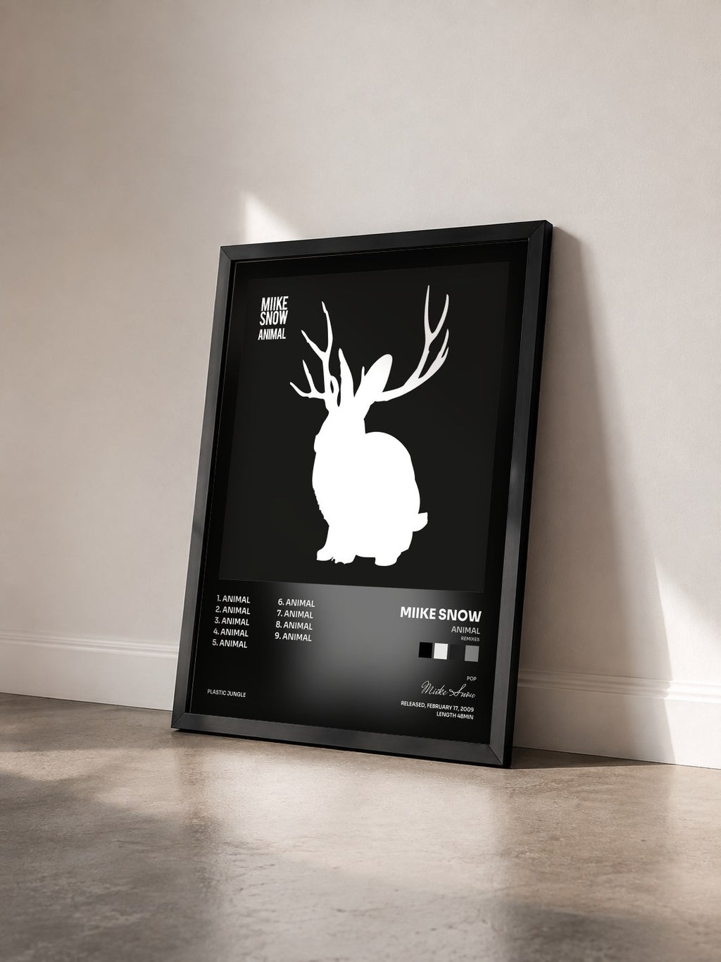#noir Tableau de l'album Animal (Remixes) de Miike Snow vu de trois quarts, cadre noir