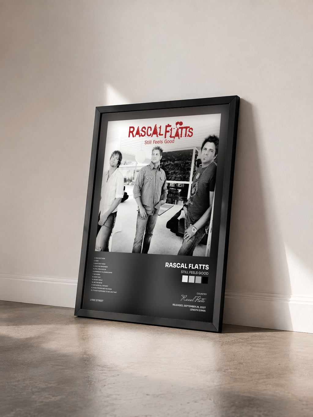 #noir Tableau de l'album Still Feels Good de Rascal Flatts vu de trois quarts, cadre noir