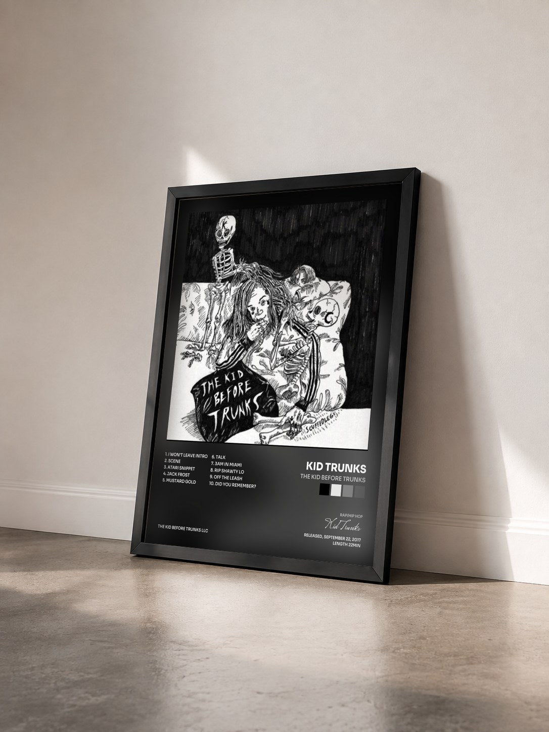 #noir Tableau de l'album The Kid Before Trunks de Kid Trunks vu de trois quarts, cadre noir