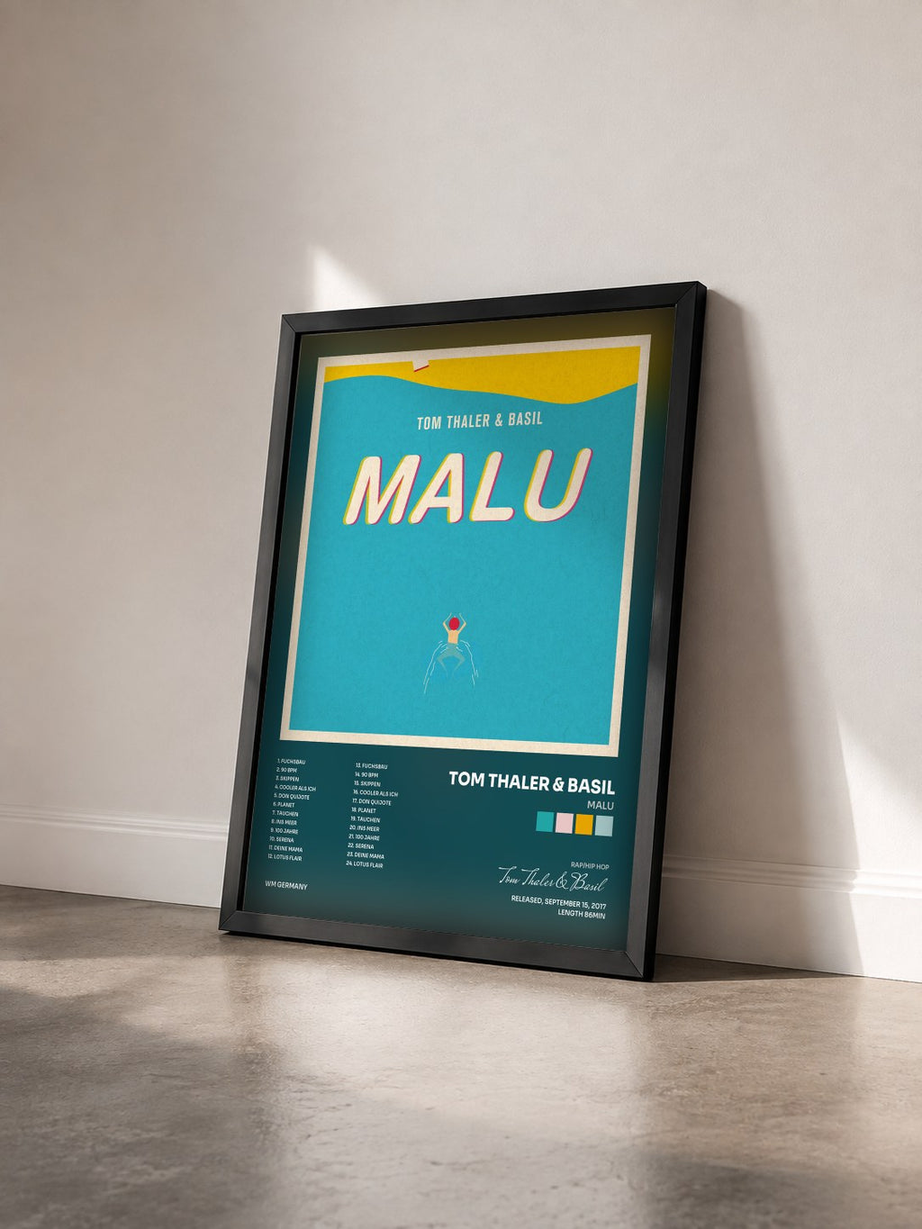 #noir Tableau de l'album Malu de Tom Thaler & Basil vu de trois quarts, cadre noir