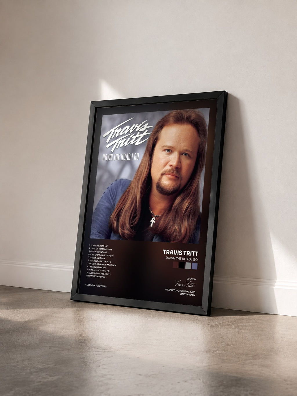#noir Tableau de l'album Down The Road I Go de Travis Tritt vu de trois quarts, cadre noir