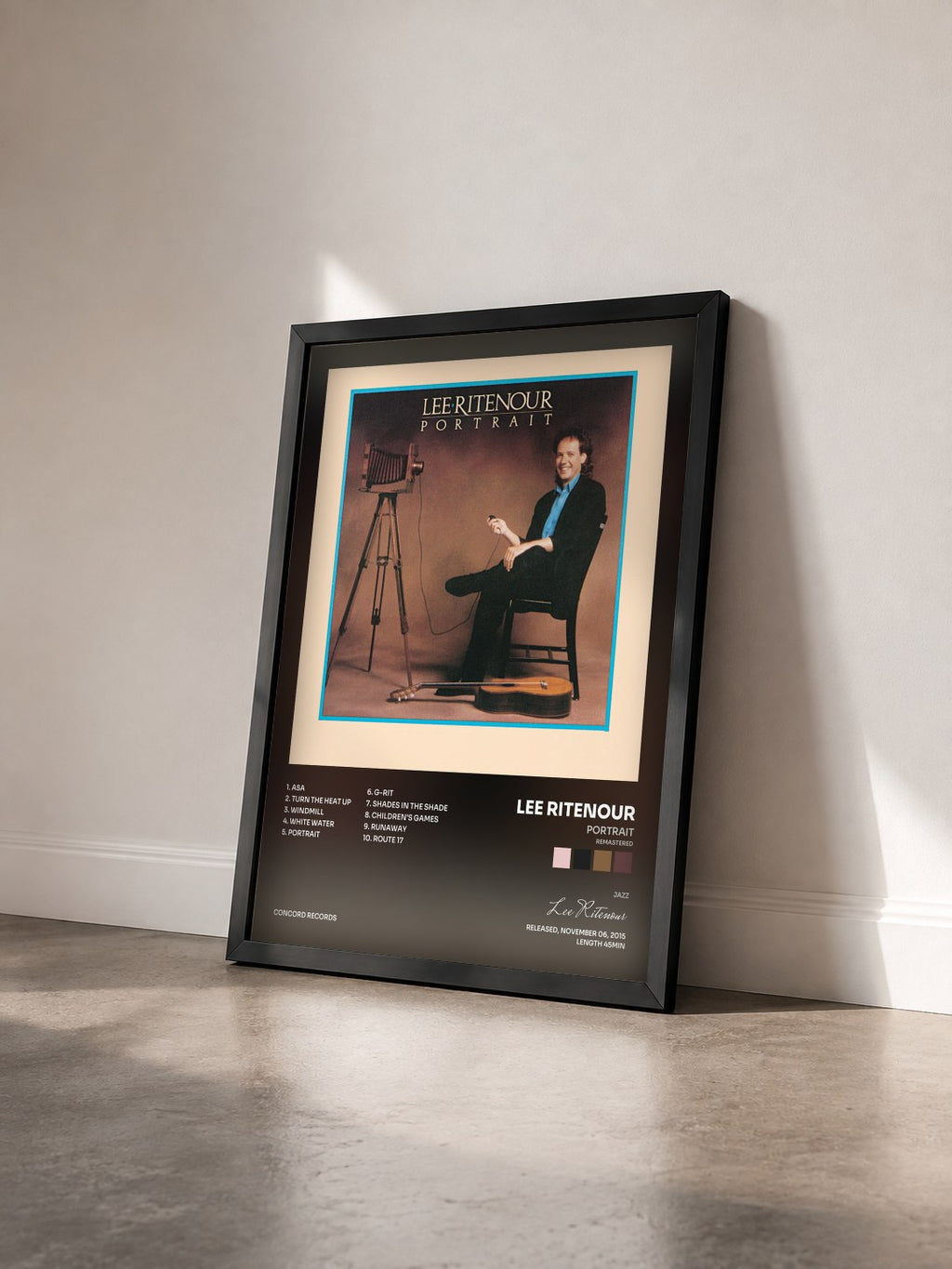 #noir Tableau de l'album Portrait (Remastered) de Lee Ritenour vu de trois quarts, cadre noir